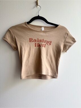 Raising Hell baby tee from Rebel Soul Collective